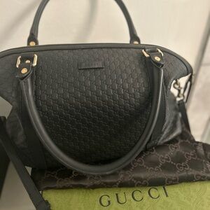 Black and gold Gucci Automatic purse